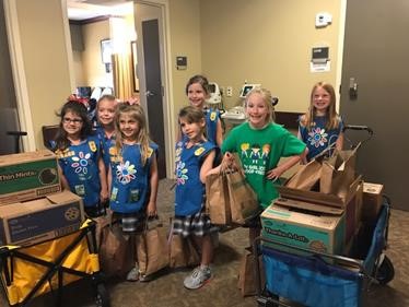 Several members of the St. Jude Catholic School's first-grade Girl Scout Troop 10133 deliver cookies and activity kits for children at the Baton Rouge General Regional Burn Center. Pictured are: Adele Crasto; Ainsley Crochet; Camille Hamner; Anna Katherine Dixon; Ella Claire Mouledous; Camille Mendler; and Emily Vercher. 