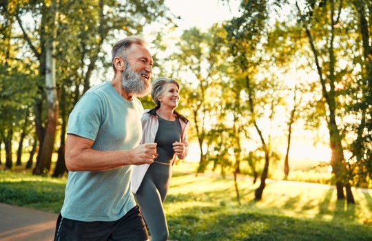 Couple running outdoors