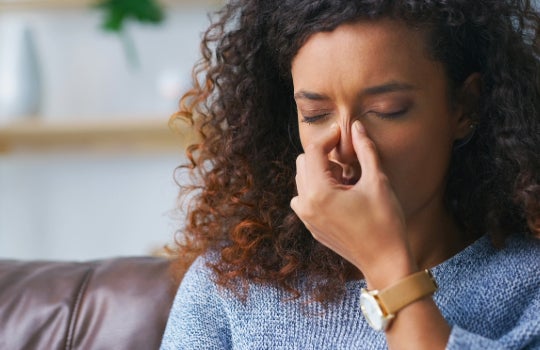 Woman with sinus pain 