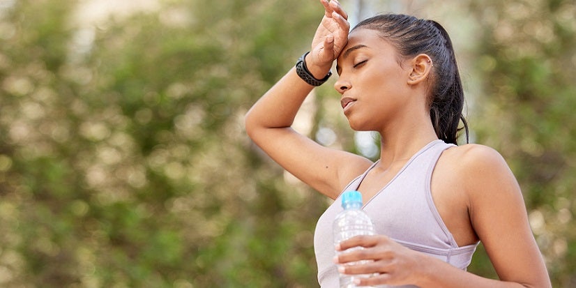 Woman sweating in heat outside