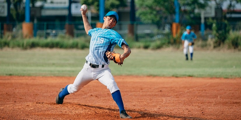 Boy throwing baseball 
