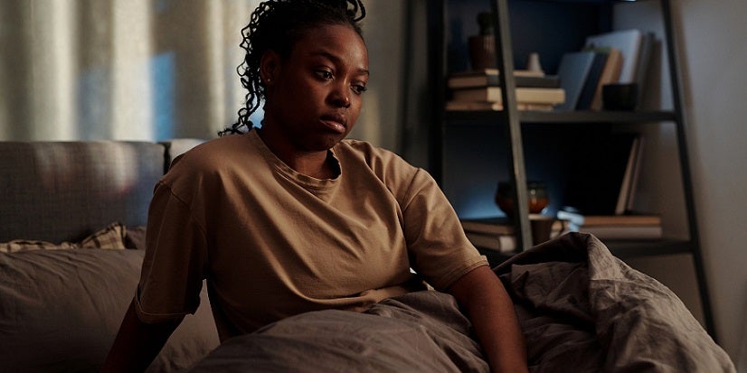 Daylight savings woman in bed 