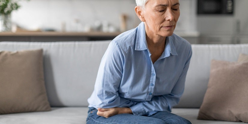 Woman holding pelvis 