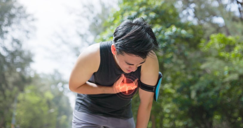 Young man having chest pains while exercising