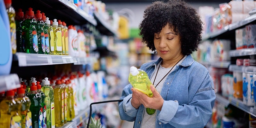 Woman looking at cleaning products