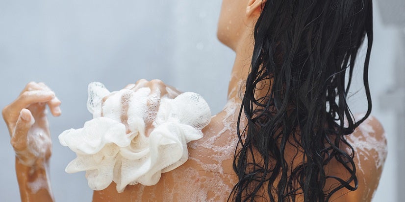 Woman washing in shower