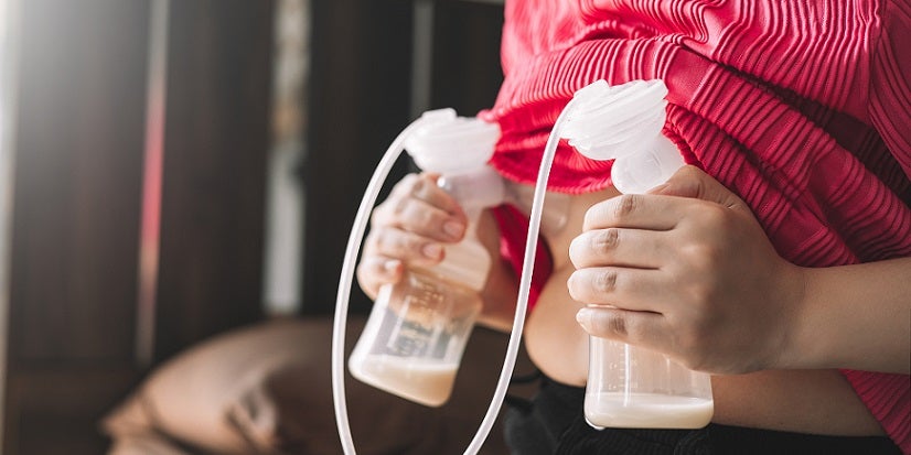 Woman pumping breast milk